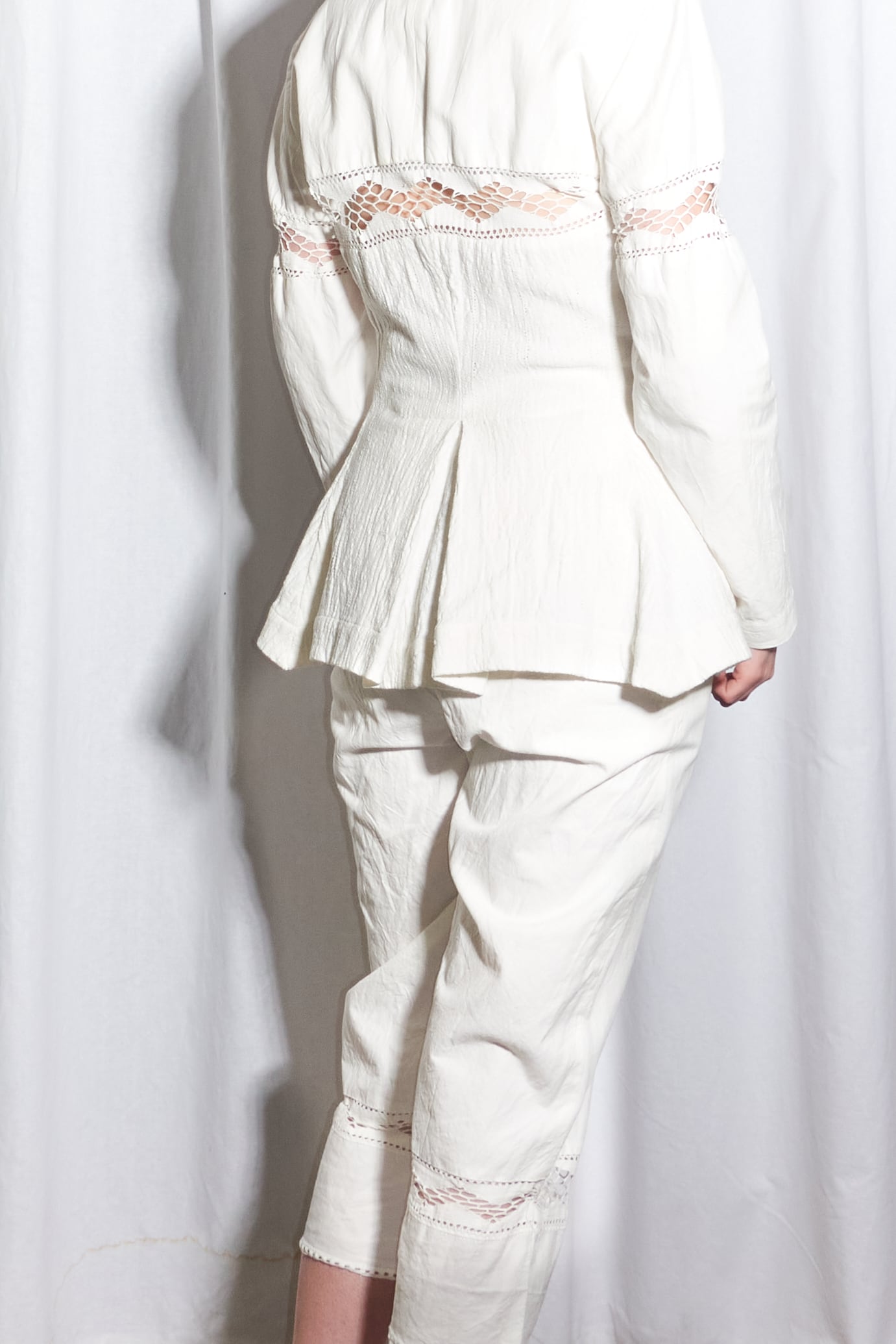 Issey Miyake multi material suit with lace cutouts