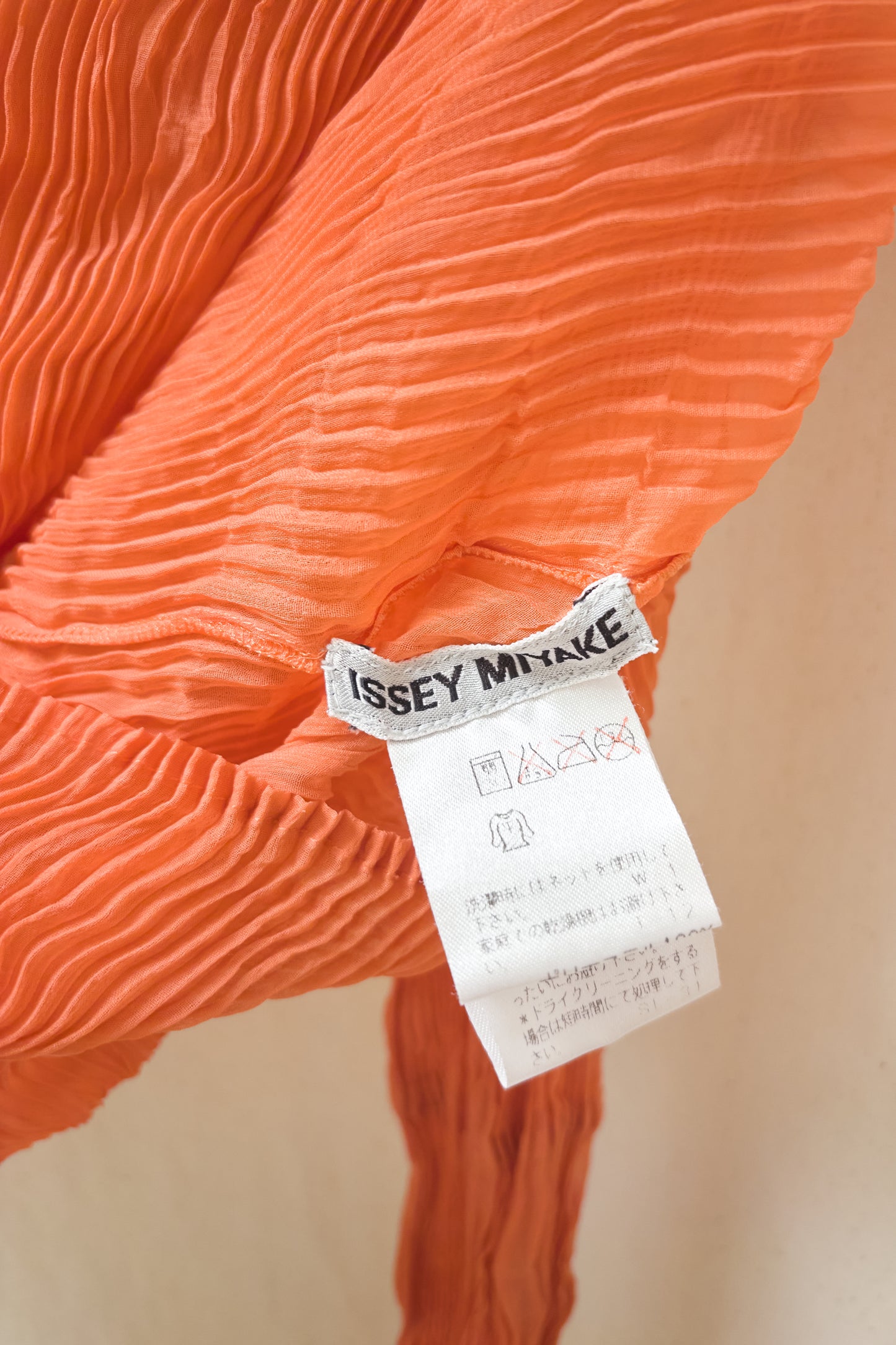 Issey Miyake orange crinkle semi-sheer longsleeve top