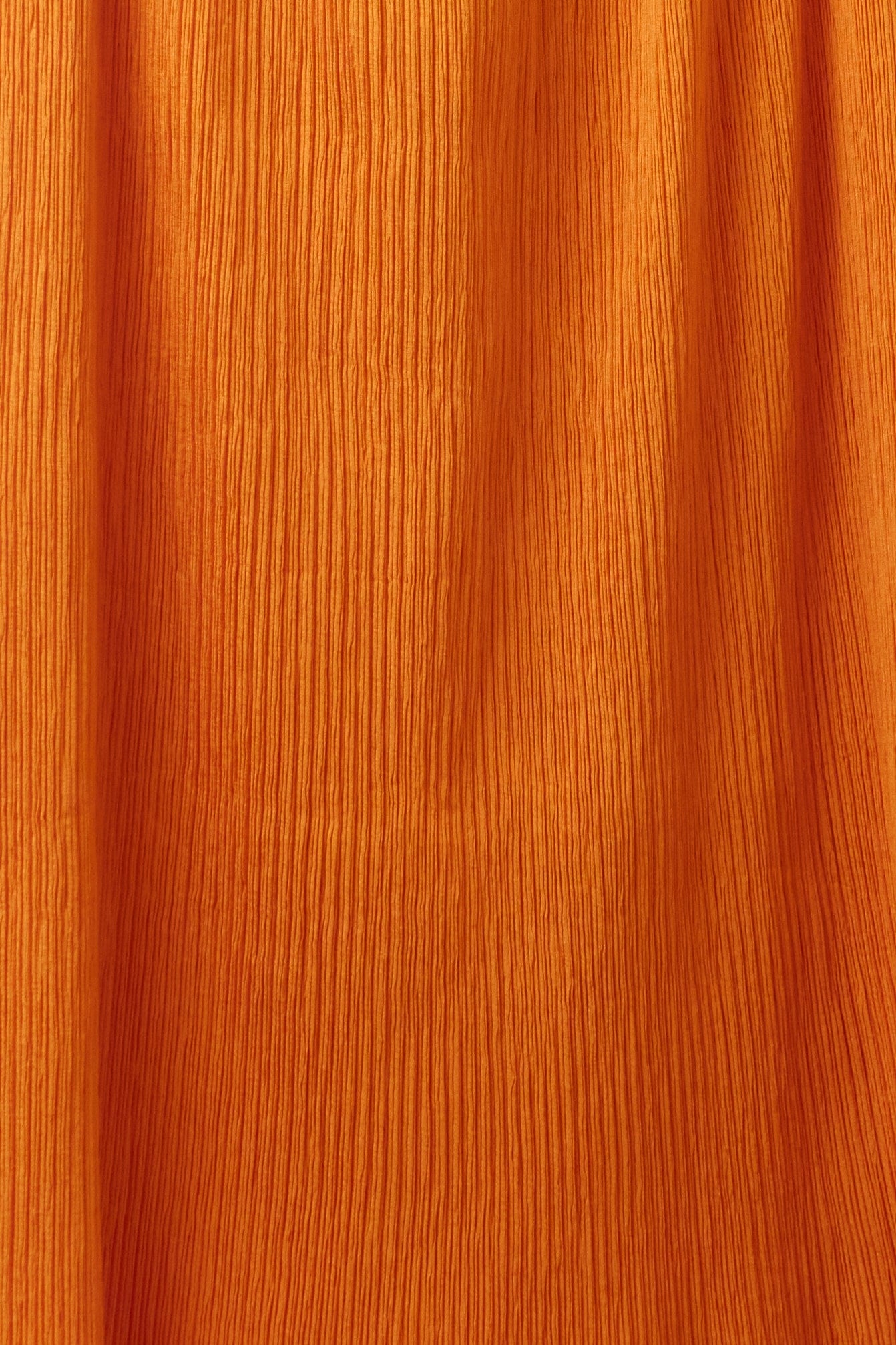 Issey Miyake orange pleated skirt