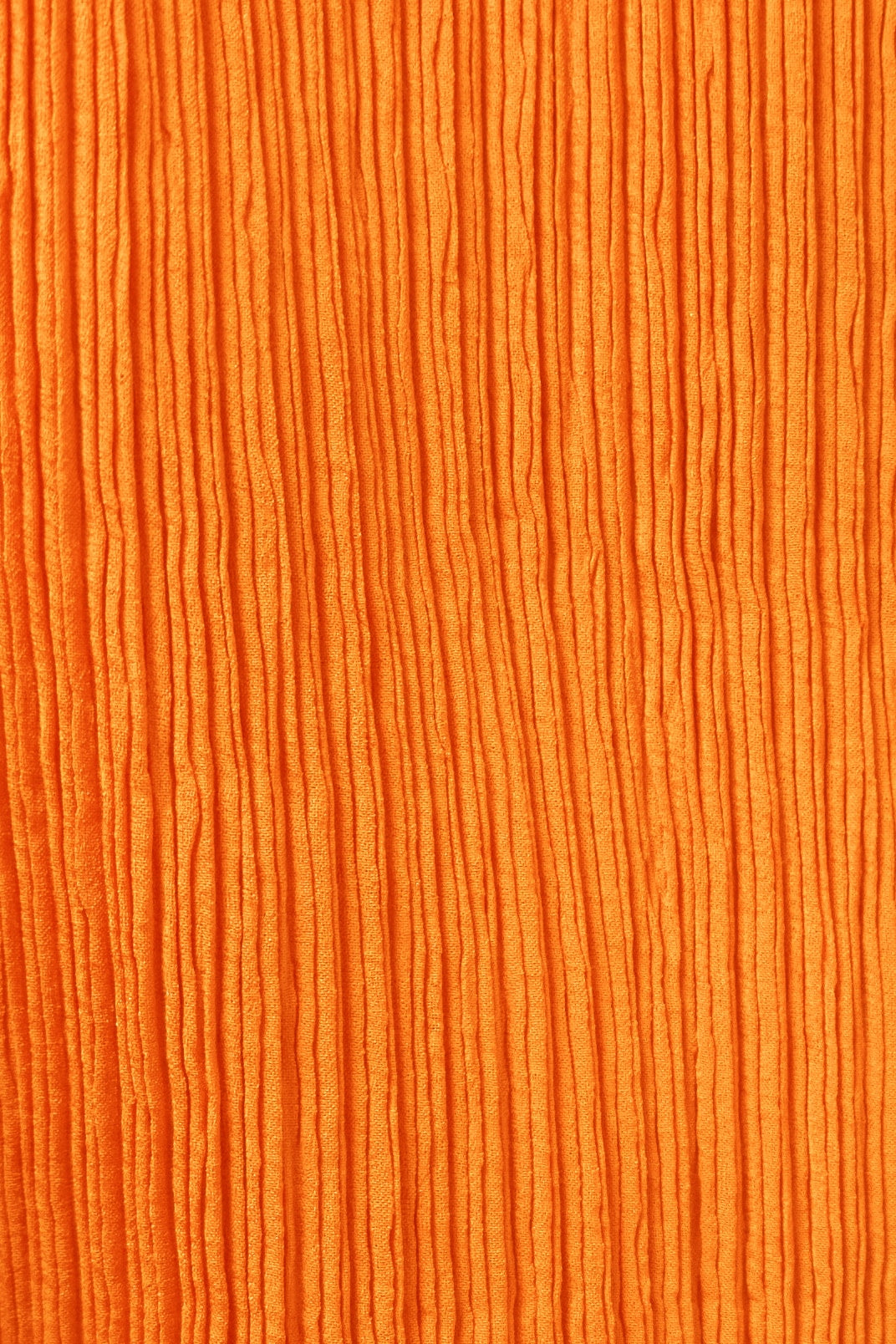 Issey Miyake orange pleated skirt