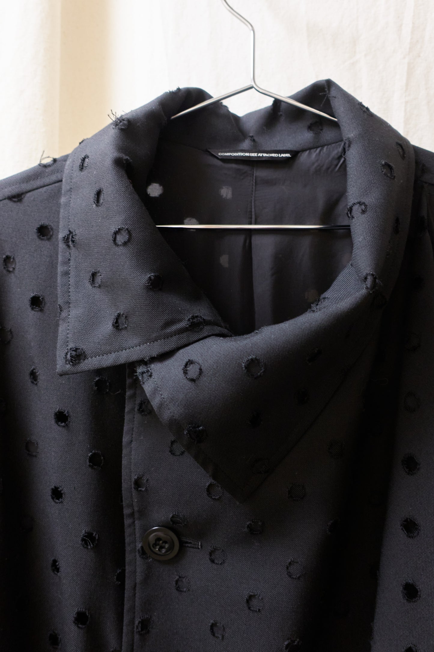 Yohji Yamamoto Y's asymmetrical 'holepunch' coat