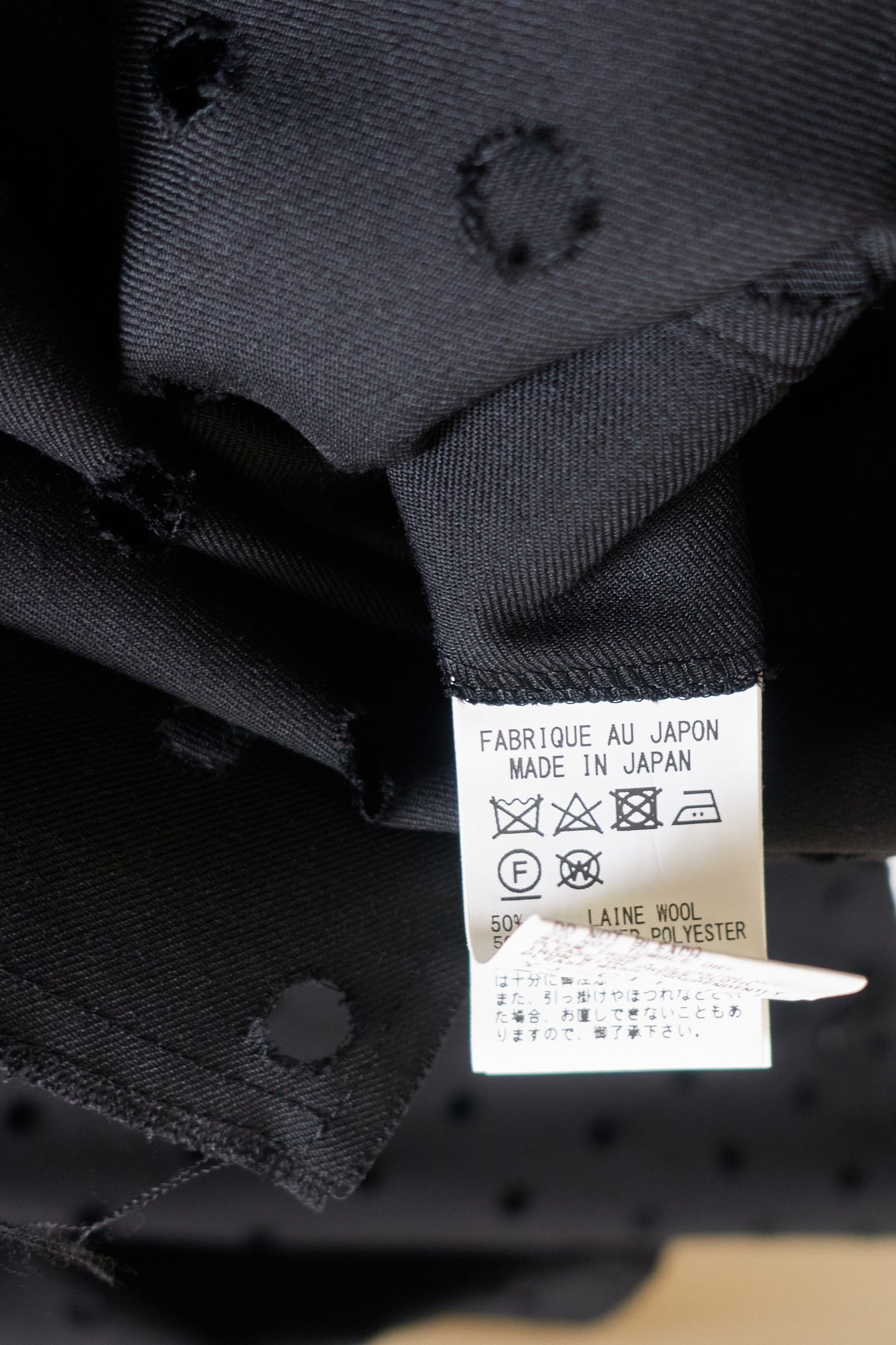 Yohji Yamamoto Y's asymmetrical 'holepunch' coat