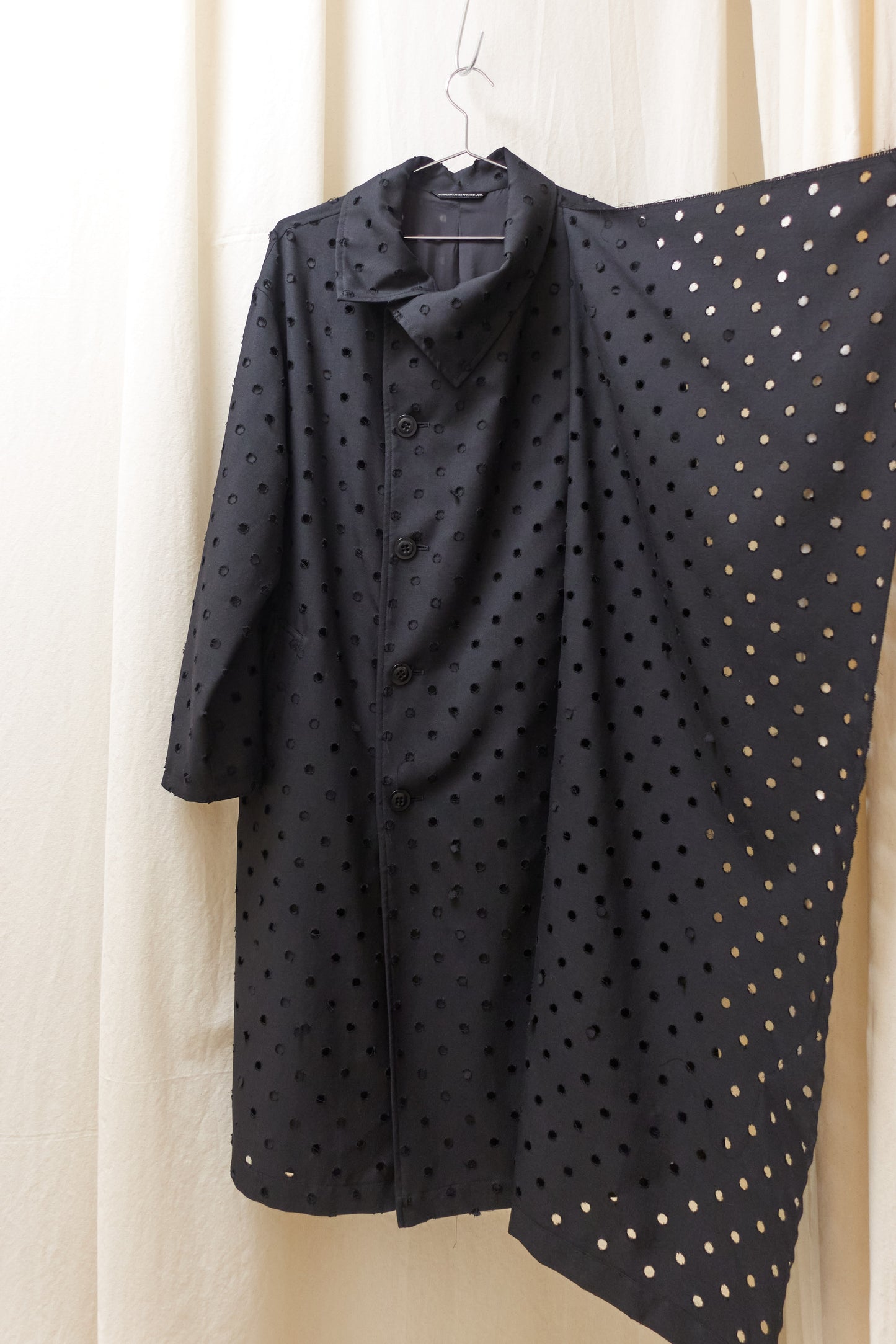 Yohji Yamamoto Y's asymmetrical 'holepunch' coat