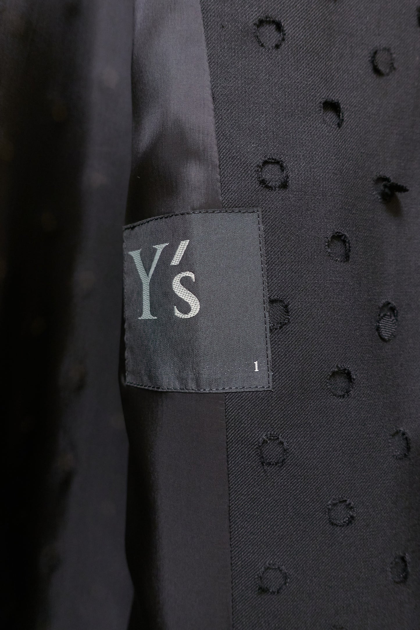 Yohji Yamamoto Y's asymmetrical 'holepunch' coat