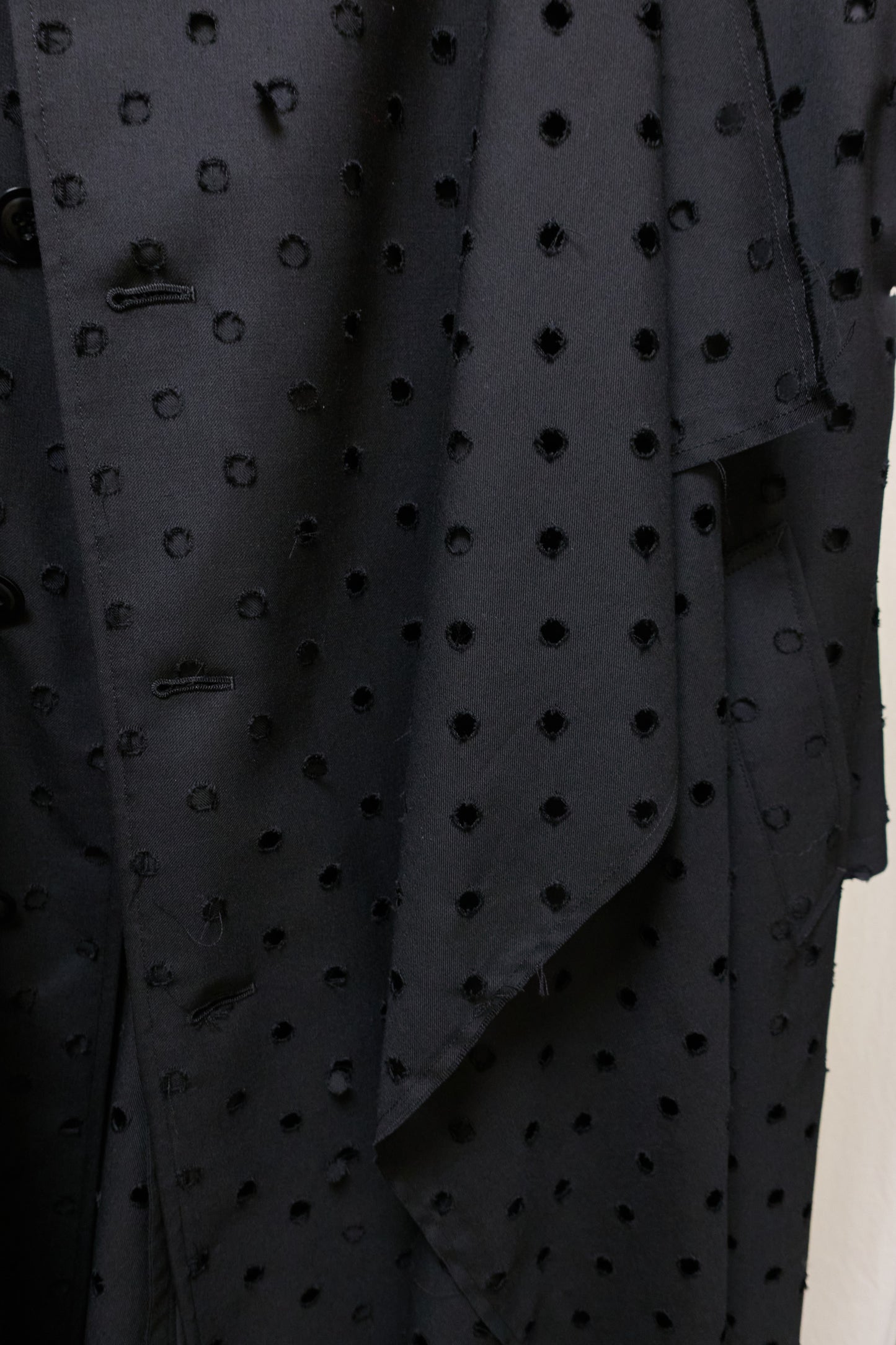 Yohji Yamamoto Y's asymmetrical 'holepunch' coat