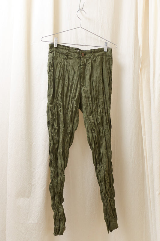 Issey Miyake green wrinkled trousers