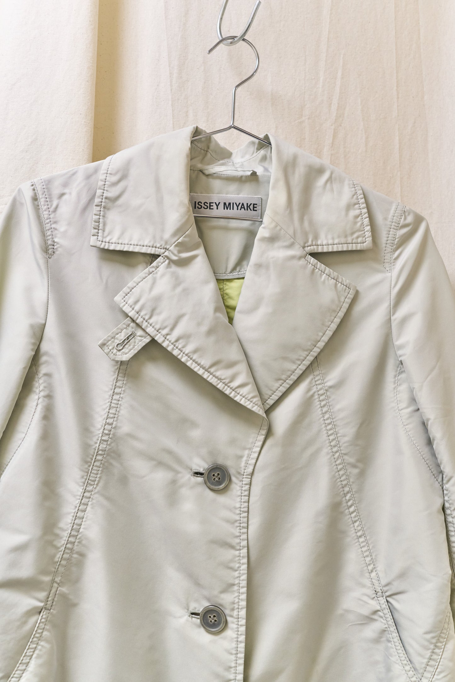 Issey Miyake sheeny trench coat with fluorescent yellow inner