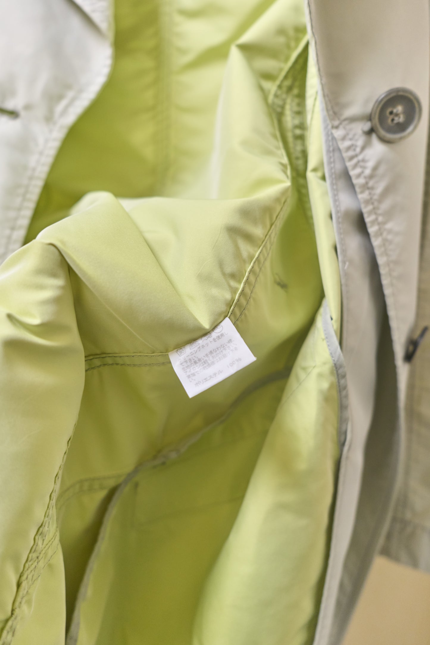 Issey Miyake sheeny trench coat with fluorescent yellow inner