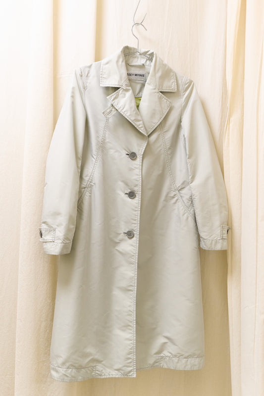 Issey Miyake sheeny trench coat with fluorescent yellow inner