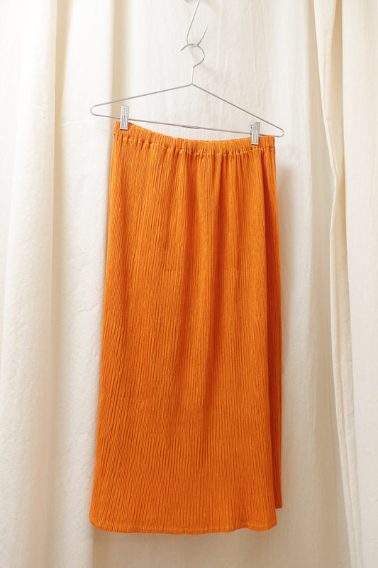 Issey Miyake orange pleated skirt