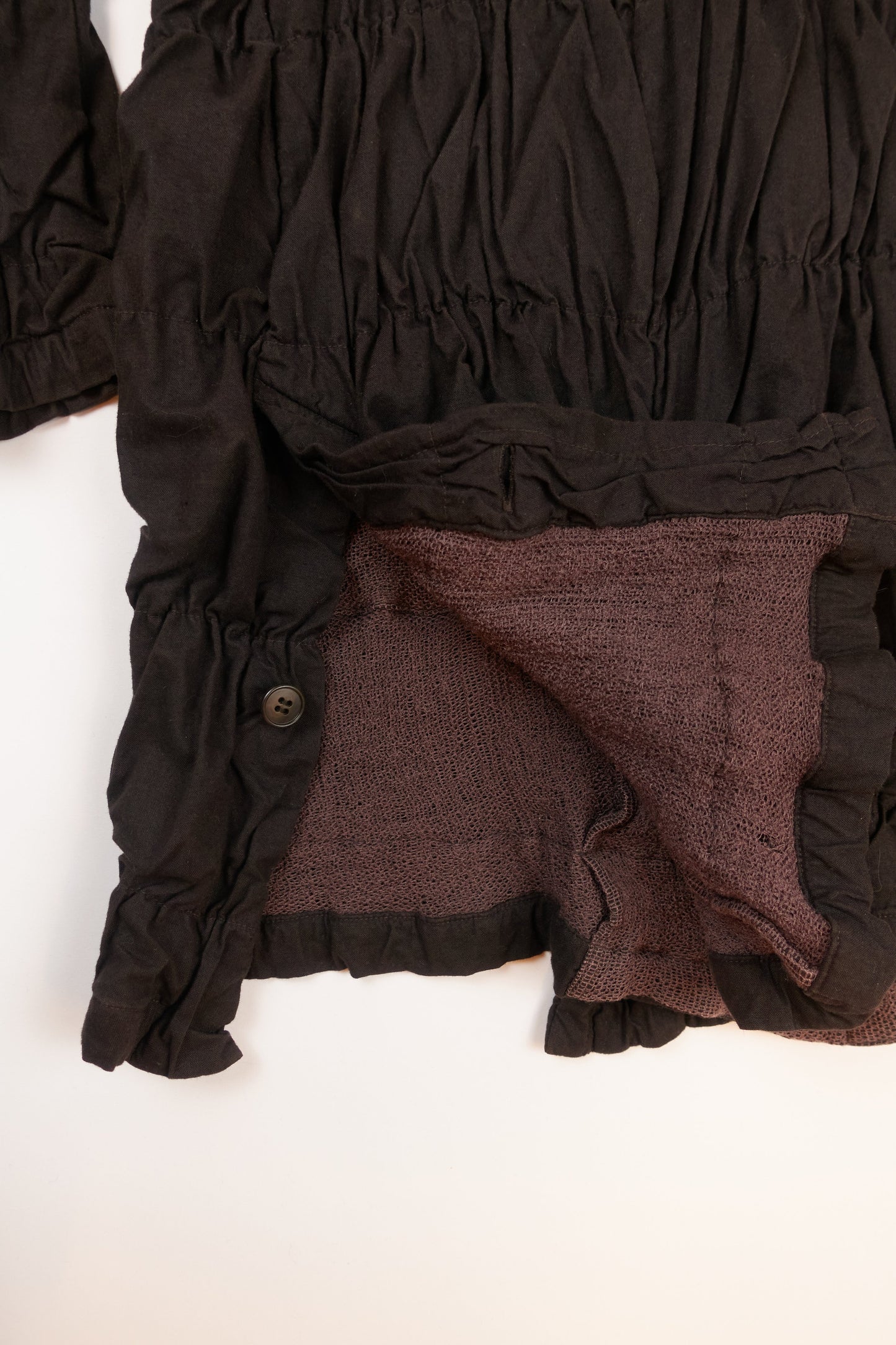 Issey Miyake Permanente shirred coat with waist tie